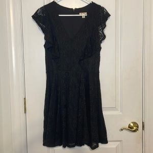 Black lace dress with ruffle detail on sleeves